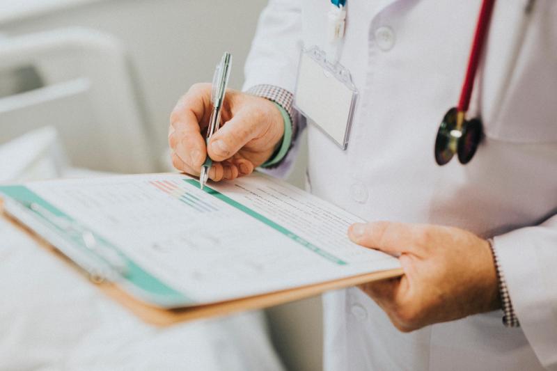 a doctor holding a clipboard